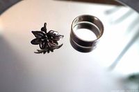 Ring and earring on mirrored surface
