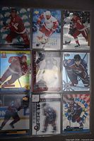 Fronts of nine hockey cards in plastic sleeve