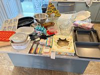 Overview of all bakeware and utensils on countertop