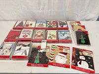 Overview of all sealed card and gift bag packages on table