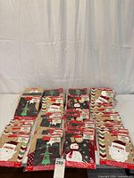 Front view showing stacked sealed packages of Christmas gift bags