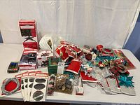 Wide view of all new packaged Christmas decorations on table