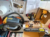 Complete sprayer components laid out: turbine base, hose, manual