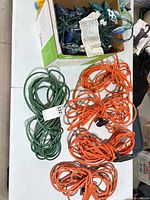 Tabletop view showing all extension cords and boxed Christmas lights