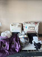 Group shot of all packaged linens and drapes