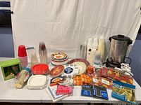 Overview of all party supplies and coffee urn on table