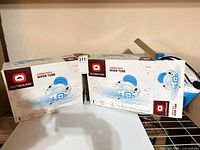 Two cartons of Outbound connectable river tubes on shelf