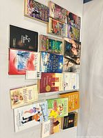 Group shot of all 22 paperback novels laid out in three rows