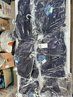 Six sealed clothing sets in original packaging