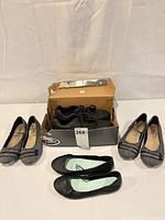 All four pairs: Dr. Scholl’s sneakers in box, grey flats, black flats