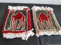 Front view of both camel motif coasters showing design and colors