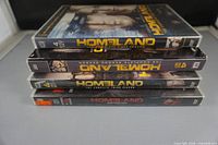 Stack of four Homeland DVD seasons showing spines