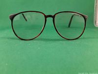 Front view of bifocal glasses showing frame style and lenses