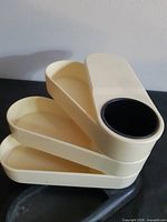 Organizer open with trays fanned out