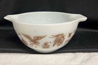Side view showing Early American brown graphics on white opal glass bowl