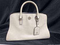 Full view of satchel front showing shape and handles