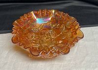 Top view of iridescent marigold open rose ruffled bowl
