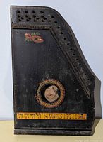 Full front view of black Meisenhauer guitar zither showing size and design