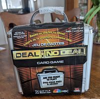 Front of sealed Deal or No Deal card game briefcase package
