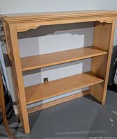 Front view of bookcase showing overall design and shelves