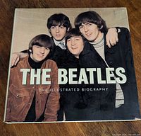 Front cover of hardcover book The Beatles: The Illustrated Biography
