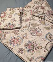 Folded king quilt and shams showing full pattern and scale