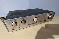 Front angled view showing overall amplifier and attached power cord