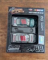 Front of boxed two-car set showing cars and branding
