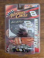 Front view of sealed Winner's Circle package showing die-cast car and collector card