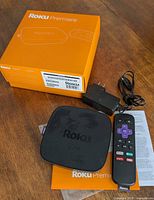 Roku Premiere device, remote, power adapter, setup guide, and box