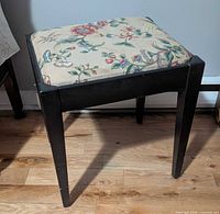 Stool front view with floral upholstered seat