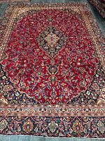 Full view of entire Mashhad rug showing pattern and borders