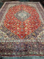 Full view of the rug showing central medallion and borders