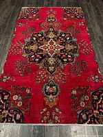 Full view of rug showing entire design and wear