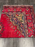 Full view of square Tabriz rug showing design and borders