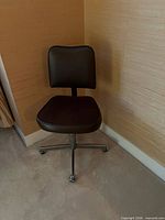 Brown vinyl office chair on chrome base