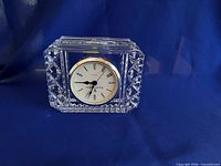 Front view showing clock face, crystal body and bezel