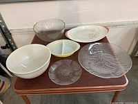 Overall view of all seven serveware pieces on table