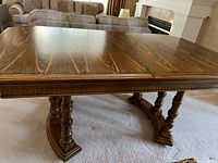 Top view of oak dining table showing grain and split for leaves
