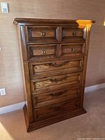 Front view showing full chest, drawer configuration, hardware