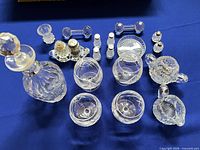 Group view showing decanter, glasses, knife rests, shakers and small pieces