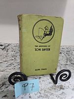 Front cover showing title, author and green cloth binding