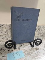 Front view of blue hardcover Life and Literature Book One showing title