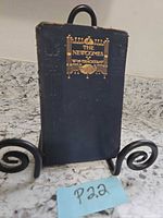 Front view of hardcover book on stand showing cover design
