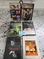 All six DVD cases on countertop