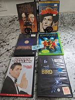 Front view showing six DVD cases including The Three Stooges Collection and Santa Fe on stands with four others below