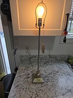 Lamp lit on countertop showing full view