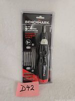 Front view of sealed Benchmark 14-in-1 ratcheting screwdriver set