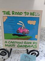 Front cover showing title, art of rabbit driving pink car into gap