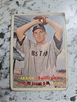 Front view of 1957 Topps Frank Sullivan card showing player photo and surface wear